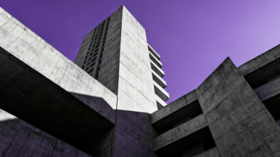 Low angle shot of a brutalist concrete skyscraper piercing a clear purple sky, sharp geometric shadows, high contrast, minimalist composition, architectural masterpiece - Created by Gifify AI Image Tool